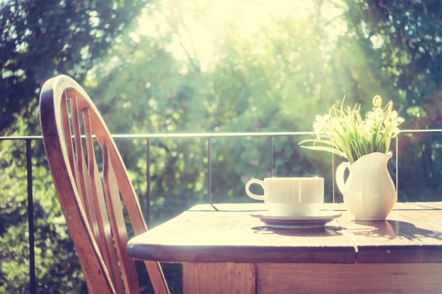 chair-with-a-wooden-table-at-sunrise_1203-2110